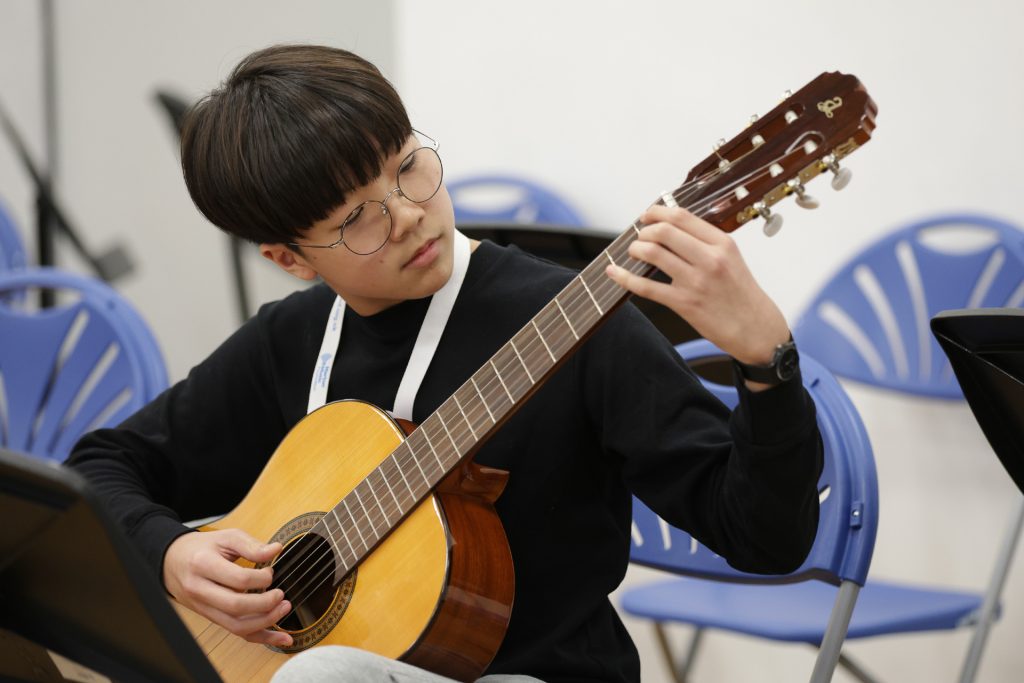 Boy playing guitar