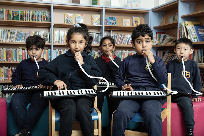 Mini Musicians class playing the melodica
