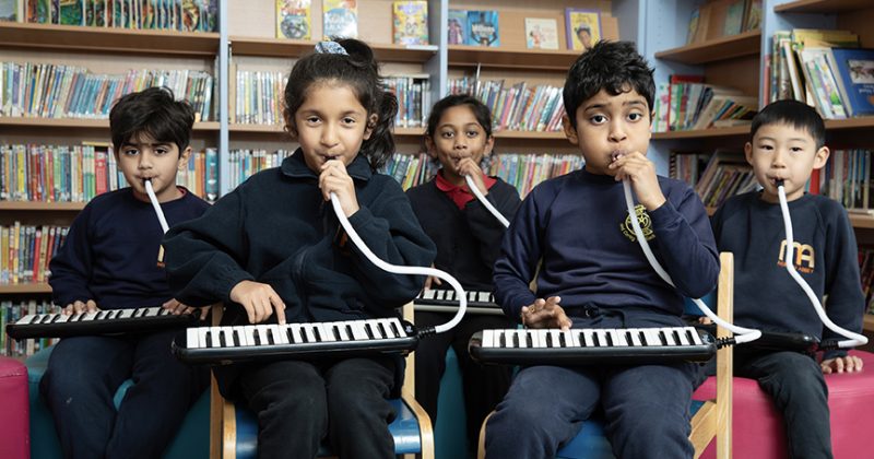 Mini Musicians class playing the melodica