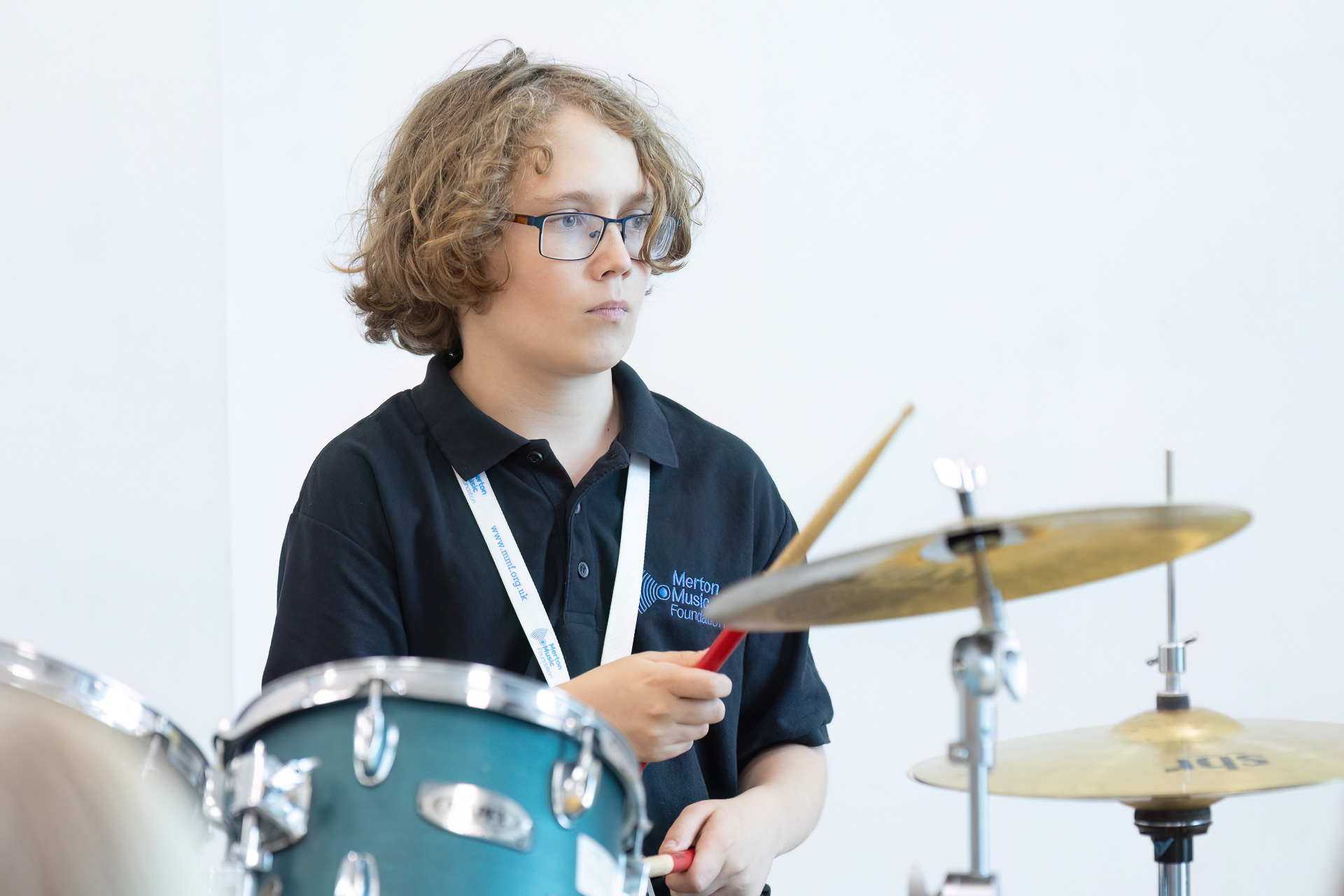 A boy playing the drums.