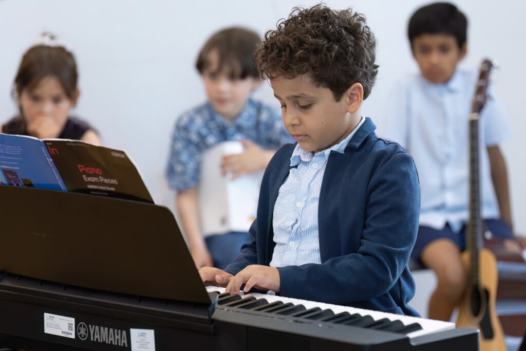 A boy playing the keyboard.