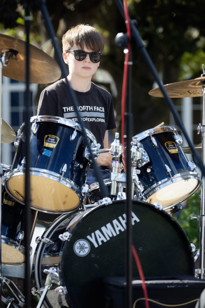 A drummer performing on stage at the Lift Off festival.