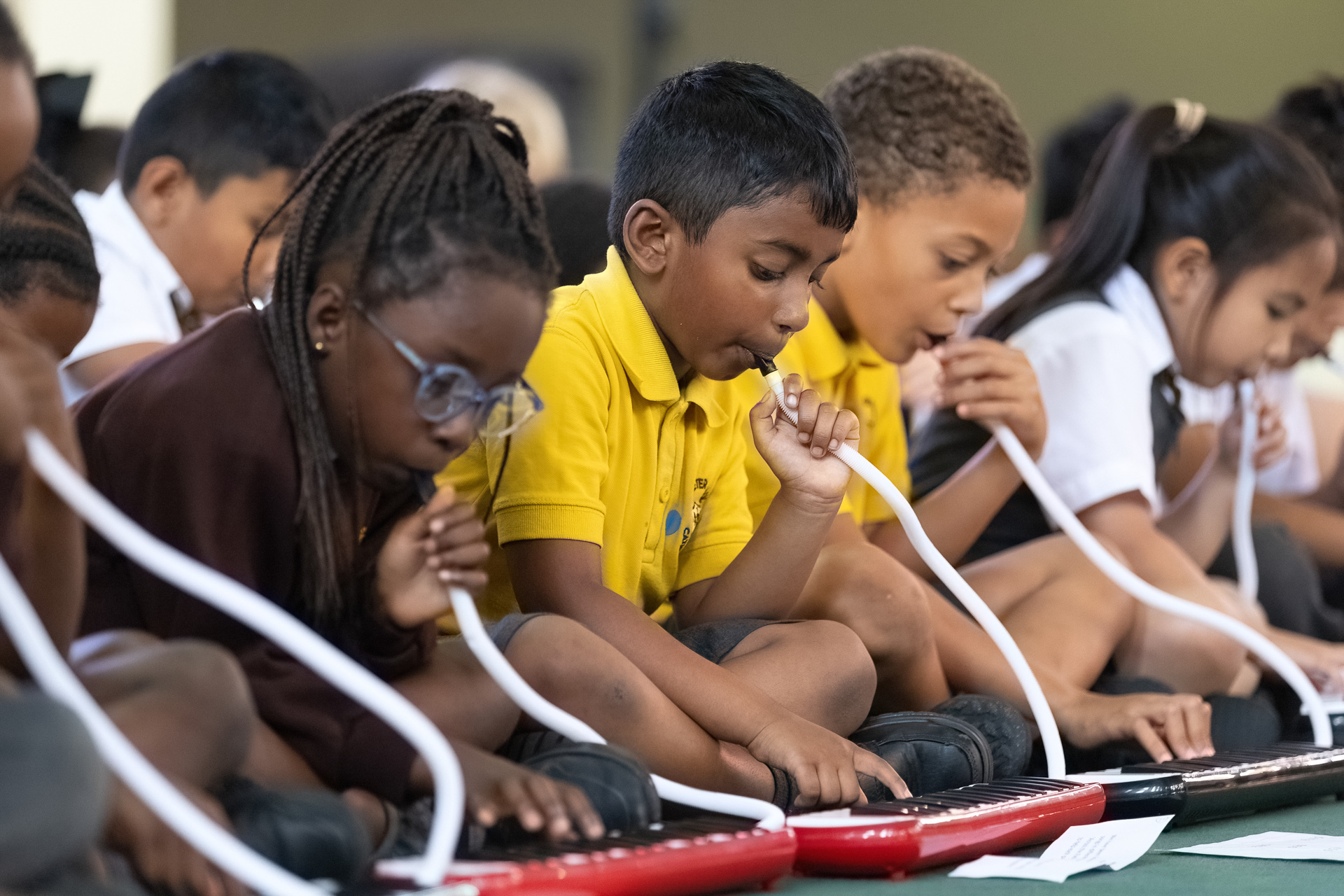 Young children playing instruments