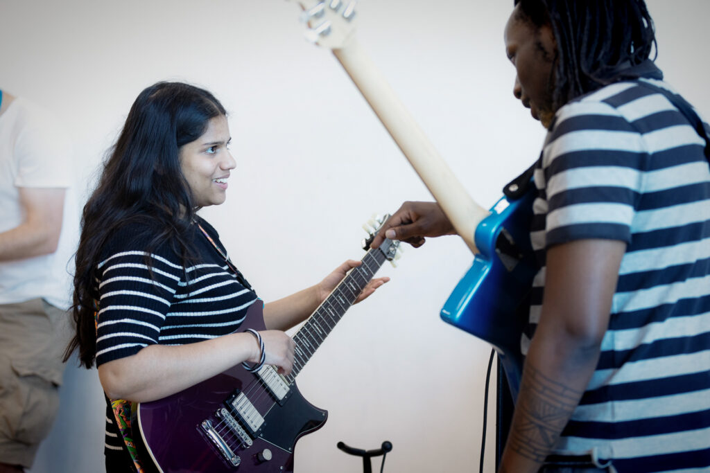 A girl playing guitar