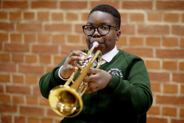 Photo of a boy playing the trumpet