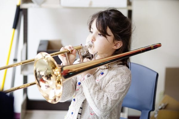 A girl playing the tombone