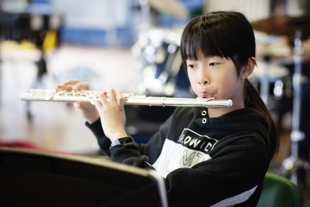 Photo of a girl playing the flute